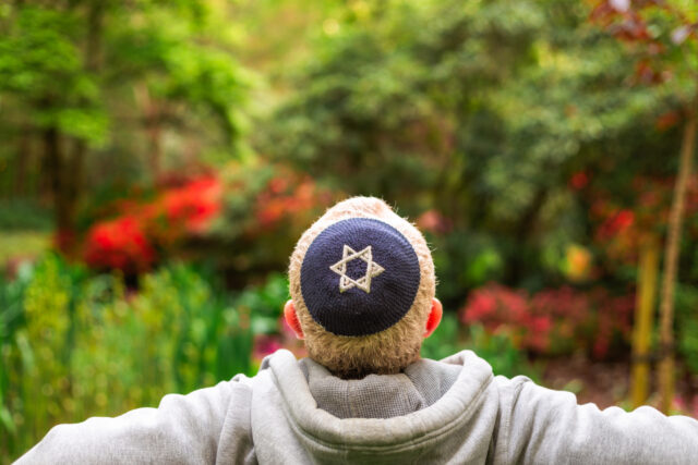 Jewish man wearing kippah in park